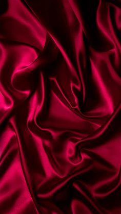 a close up view of a red satin fabric with very high resolution and grainy texture