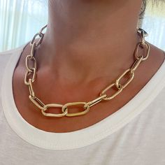 This Italian handcrafted chain link necklace is completely composed of 14K solid gold and is uniquely made with a semi-hollow interior for comfortable everyday wear that will not dent. NOTE: This item is available in longer or shorter length options. Kindly email us for pricing and details. Total Length: available in your choice of 14, 16, 18, 20, 22, 24, 26 or 30 inches Total Gram Weight: 18" length comes out to approximately 33.8 grams of 14K solid gold Link Dimensions: approximately 14mm (W) Gold Plated Oval Chain Necklace, Yellow Gold Chunky Chain Jewelry With Oval Links, Luxury Oval Paperclip Chain Jewelry, Gold Chunky Chain Oval Jewelry, Gold Jewelry With Chunky Chain In Oval Shape, Gold Jewelry With Chunky Chain And Oval Shape, Gold Oval Jewelry With Chunky Chain, Gold-tone Oval Jewelry With Gold Chain, Modern Oval Gold-tone Jewelry