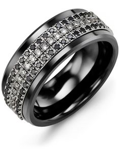 a black and white diamond ring with two rows of diamonds on the inside of it