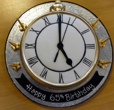 a birthday cake with a clock on it