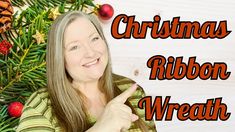 a woman pointing at the camera with christmas decorations around her and text that reads, christmas ribbon wreath