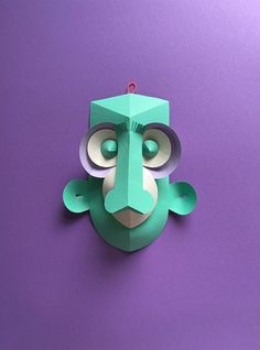 an origami animal mask on a purple background