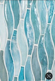 blue and white glass tile with wavy lines