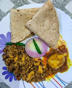 a white plate topped with different types of food