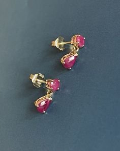 9ct Yellow Gold Ruby Earrings Pear Drop Studs 1.20ct 6x4 mm pear cut set with round cut combined carat 1.20ct Deep shade of pink red Ruby for coloured gems lover Hallmarked 9ct 375 Just under 2g Please see pics for measures "Free Next-day UK Delivery Safe, secure and insured delivery from our reliable delivery partners "What You See is What You Get" Promise Every photo you see is of the actual item. No trick lighting or editing" Classic Pink Drop Jewelry, Classic Pink Pear Shaped Jewelry, Classic Pink Pear-shaped Jewelry, Pink Teardrop Earrings With Prong Setting, Ruby Earrings Gold, Gold Ruby Earrings, Red Ruby Earrings, Small Earrings Gold, Coral Jewelry Set