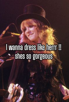 a woman wearing a top hat and holding a microphone with the words i wanna dress like her