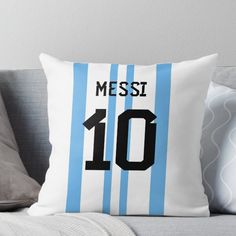 a blue and white striped throw pillow with the number ten on it's side