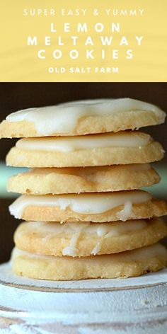 a stack of cookies sitting on top of a white plate with frosted icing