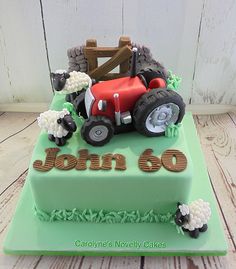 a birthday cake with a tractor and farm animals on it