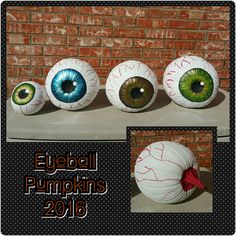 three paper mache pumpkins with painted eyes on them and the words eyeball pumpkins 2016