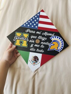 someone is holding up a graduation cap decorated with flags and the words florida, miami, puerto