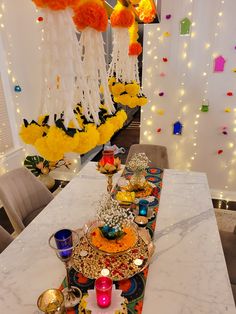 the table is decorated with colorful decorations and candles