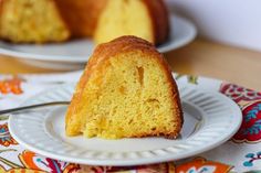 a bundt cake on a white plate with a bite taken out of the side