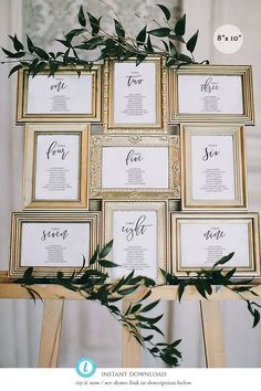 an arrangement of framed photos with greenery on the top and bottom, in gold frames