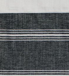 a black and white rug with stripes on it