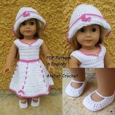 the doll is wearing a crocheted dress and hat with pink trimmings