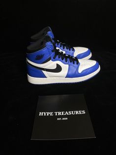 Jordan 1 Retro High OG GS Game Royal Size 6.5Y Clean 575441 403 - HYPETREASURES (womens 8)  Elevate your sneaker game with these stylish and iconic Air Jordan 1 Retro High OG Game Royal 2018 sneakers. Featuring a high top shoe shaft style, these sneakers are perfect for men who want to make a statement with their footwear. The blue leather upper material is both durable and stylish, and the retro theme adds a touch of nostalgia to these modern sneakers. With a UK shoe size of 6 and a US shoe size of 6.5, these sneakers are sure to fit comfortably. The style code is 575441403, and the model is Air Jordan 1. These sneakers are not customized and are not vintage. They were manufactured in China in 2018, and the product line is Air Jordan. Buy these athletic sneakers today and step up your sho Blue Leather Jordans, Air Jordan 1 Retro High Og, Retro Theme, Air Jordan 1 Retro, Sneaker Games, Jordan 1 Retro, Jordan 1 Retro High, Athletic Sneakers, Top Shoes