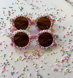 the sunglasses are decorated with colorful sprinkles