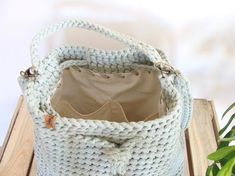 Casual Handmade Beige Bucket Bag, Casual Crochet Bucket Bag For Summer, Summer Crochet Bucket Bag With Removable Pouch, Summer Bucket Bag With Pockets For Daily Use, Chic Crochet Bucket Bag With Removable Pouch, Daily Use Bucket Crochet Bag With Braided Handles, Spring Bucket Crochet Bag With Handles, Chic Bucket Bag Tote With Pockets, Chic Bucket Tote Bag With Pockets