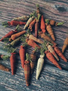 several carrots are arranged on a wooden surface