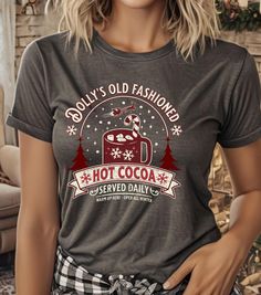 Stay cozy and festive with this personalized old-fashioned hot cocoa T-Shirt featuring a mug, candy cane, and Christmas trees. Perfect for anyone looking to add a touch of holiday spirit to their wardrobe. Product features - Made from durable and smooth 100% ring-spun cotton fabric - Classic fit with crew neckline for versatile style - Ethically grown and harvested US cotton for sustainability - Variety of fabric blends for different color options - Pearlized tear-away label for added comfort Ca Holiday Shirt, Christmas Candy Cane, Holiday Shirts, Winter Holiday, Christmas Candy, Hot Cocoa, Winter Holidays, Shirt Price, Candy Cane