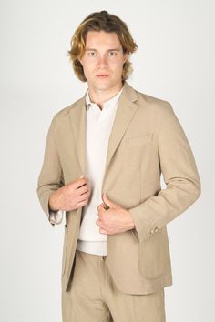 Expertly crafted with a blend of cotton and linen, this unlined jacket features a two-button closure and notched lapels for a classic and sophisticated look. Experience the comfort and breathability of natural fibers, making it the perfect choice for any occasion. Beige Casual Semi-formal Suits, Linen Outerwear With Single Button And Lapel Collar, Single Button Linen Outerwear With Lapel Collar, Beige Sport Coat With Welt Pockets And Suit Collar, Business Casual Linen Outerwear With Patch Pockets, Casual Beige Blazer With Suit Collar, Linen Outerwear With Patch Pockets For Business Casual, Linen Outerwear With Patch Pockets And Suit Collar, Casual Beige Blazer For Semi-formal Occasions