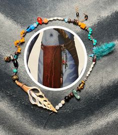 an image of a woman's head with beads and other items around it on a gray surface