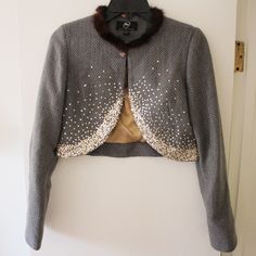 True Meaning Crop Embellished Jacket - Price Is Firm Since Priced Low Low To Go! Thanks! Brand New Without Tag - Never Used - Perfect Condition Poly, Wool, Acrylic Blend. Gorgeous!! Kinda Sad To Sell This But Unfortunately Doesn't Fit - So Enjoy! Gold Sequins And I Think The Fur Around The Neck Is Rabbit..It's Super Soft And Fluffy. Buttons At The Neck With A Pretty Blue Rhinestone Broach That Is Attached To Jacket. Length: 16" Shoulder To Wrist: 24" Embellished Jacket, Low Low, Gold Sequins, Blue Rhinestones, To Sell, Meant To Be, Size 4, Jackets & Coats, Jackets For Women