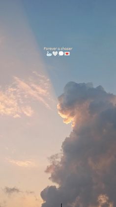 an airplane is flying in the sky with clouds