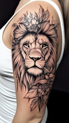 a woman's arm with a lion and flowers tattoo on the left side of her body