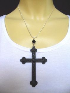 "This is a lovely black cross themed pendant necklace. The cross is approx. 8cm long x 5.5cm wide - so a good sized cross. On an 18\" silver plated snake chain. Thanks for looking!!" Black Metal Cross Necklace, Handmade Black Crucifix Necklace, Black Metal Crucifix Cross Necklace, Black Metal Crucifix Necklace, Handmade Black Cross Pendant Jewelry, Handmade Black Cross Pendant Necklace, Handmade Black Cross Necklace, Spiritual Black Sterling Silver Cross Necklace, Black Cross Necklace