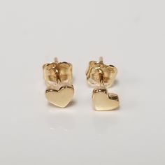 "Thanks for shopping our vintage estate store. We tend to sell well below wholesale and truly hope you enjoy all of our items. Many of the items are one of a kind, so please enjoy scrolling through the pictures and hopefully something will catch your eye. Brown spots are from camera or reflections. Beautiful estate new 14k yellow gold genuine heart studs. Width: 1/4\" 3.5mm Weight: .35 gram Marked 14k and backs are included 14k." Gold Earrings For Anniversary On Valentine's Day, Vintage Double Heart Earrings For Anniversary, Dainty Earrings For Anniversary On Mother's Day, 14k Gold Earrings For Anniversary And Mother's Day, Dainty Earrings For Anniversary And Mother's Day, Dainty Earrings For Mother's Day, Hallmarked Heart Earrings For Valentine's Anniversary, Classic Gold Heart Earrings For Anniversary, Yellow Gold Earrings For Anniversary On Valentine's Day