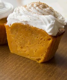 pumpkin pie cupcakes with whipped cream on top and the words impossible pumpkin pie cupcakes