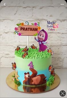 a birthday cake decorated with cartoon characters