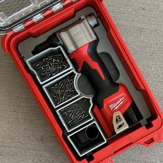 a red tool box with tools in it