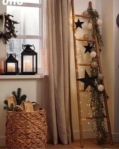 a ladder is next to a window with christmas decorations on it and lights in the windowsill