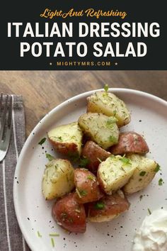 a white plate topped with potatoes and cream