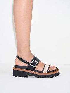 You can count on this sturdy pair of sandals for your day-to-day wear and more. The classic double-strapped design is elevated with buckled details and linen panels that create a subtle visual contrast. In versatile black, they are easy to style yet polished in appearance. For a height boost that still feels comfortable, the sandals are set on cushioned platform soles so you can wear them for just about anything. Slingback Sandals, Charles Keith, Slingback Sandal, Black Sandals, Buckle, Sandals, How To Wear, Black, Design