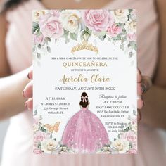 a woman in a pink dress holding up a princess themed birthday party card with flowers on it