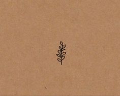 a drawing of a plant on top of a piece of brown paper