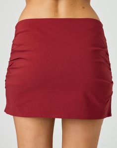 This skirt features a mini length, gathered detailing and hidden side zip closure. Pair it with the matching top and feels for a perfect night out fit. Ruched Relaxed Skirt For Day Out, Ruched Summer Skort, Short Length, Stretch Gathered Mini Skirt For Day Out, Ruched Mini Skort For Summer, Ruched Short Length Skort For Summer, Stretch Mini Skirt With Gathered Details For Day Out, Ruched Short Length Summer Skort, Summer Mini Skort With Ruched Details, Summer Pencil Skirt Bottoms With Side Zipper