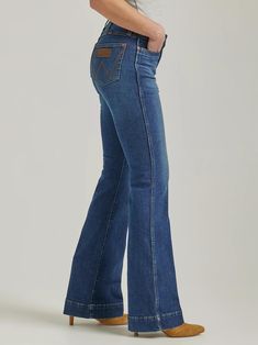 Fit: Regular Rise: High Front Rise: 10 1/4" Leg: Trouser Leg Opening: 21 1/2" Front Closure: Zip-Fly with button closure Back Pockets: Two back pockets with no closure Wrangler Jeans Women's, 2023 Wardrobe, Petticoat Junction, Wrangler Women, Retro Jeans, Country Wear, Concert Outfits, Wide Trousers, Clothing Jeans