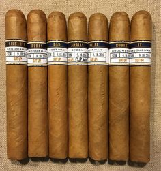 five cigars are lined up in a row