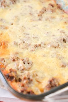 a casserole dish with meat and cheese in it on top of a table