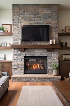 a living room with a couch, fireplace and television