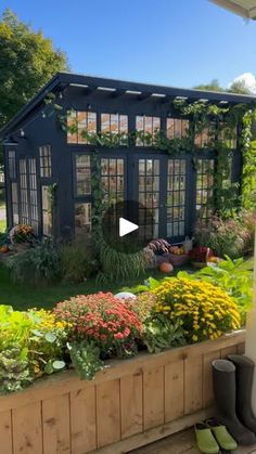 a garden with lots of flowers and plants in it