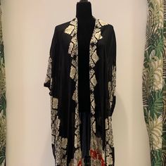 Long Traditional Kimono Wears With Everything. Long Black Embroidered Outerwear, Black Long Embroidered Outerwear, Bohemian Black Outerwear For Vacation, Black Bohemian Outerwear For Vacation, Black Open Front Kimono For Fall, Black Outerwear For Vacation In Fall, Black Bohemian Summer Outerwear, Chic Black Outerwear For Vacation, Bohemian Black Summer Outerwear