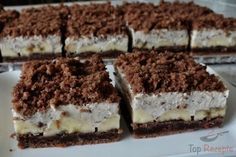 several pieces of dessert sitting on top of a white plate