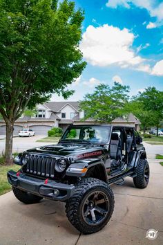 a black jeep parked on the side of a road