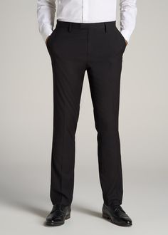 About Our Suit Trousers for Tall Men Crisp, classic and comfortable. That’s what you’ll find in these suit trousers for tall men. Thoughtfully designed for men from 6’ to 7’1, these pants have an extended inseam for longer legs without the extra bagginess you usually find in a longer pant. They’re made with a slightly stretchy polyester blend and feature a comfortable cotton-blend lining. These men’s tall pants feature a tailored fit for a modern look that’s easy to wear from the office to the e Classic Black Slim Fit Work Pants, Classic Tailored Bottoms For Black-tie Events, Tailored Classic Bottoms For Black-tie Events, Classic Business Suits With Long Pants, Classic Black Slim Fit Pants, Black Tuxedo Style Slim Fit Bottoms, Black Tuxedo Slim Fit Bottoms, Black Slim Fit Tuxedo Bottoms, Classic Black Slim Fit Dress Pants